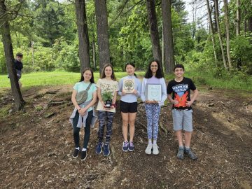 Students from the DMS County Envirothon Team holding their certificates